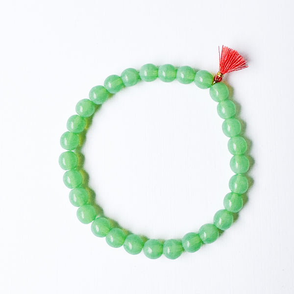 Build your own set of three Smooth Glass Bead Stretch Bracelets with Tassel