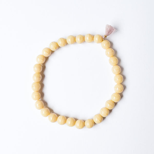 Build your own set of three Smooth Glass Bead Stretch Bracelets with Tassel