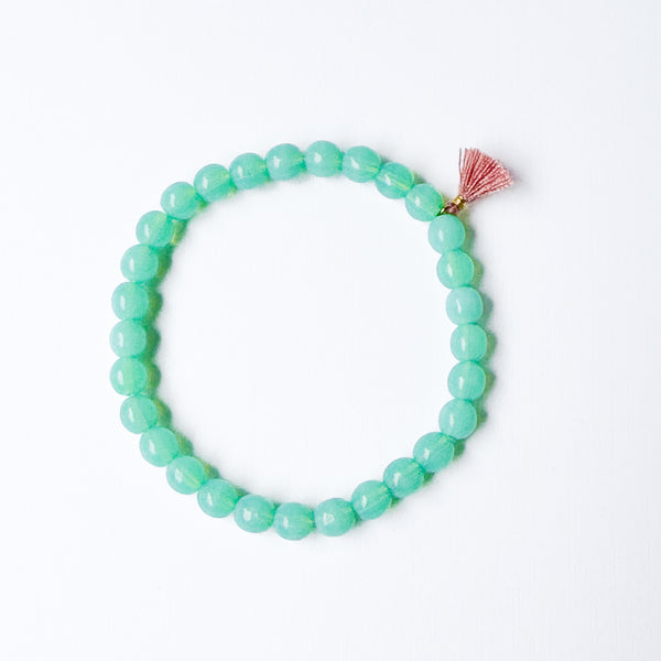 Build your own set of three Smooth Glass Bead Stretch Bracelets with Tassel