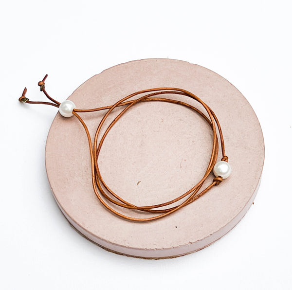 Pearl and leather wrap triple bracelet