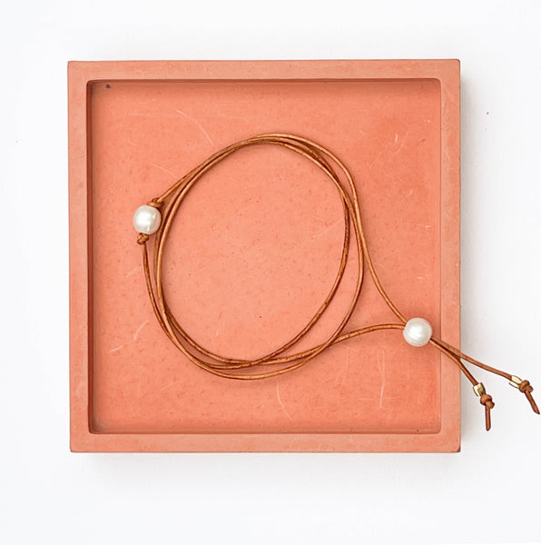 Pearl and leather wrap triple bracelet